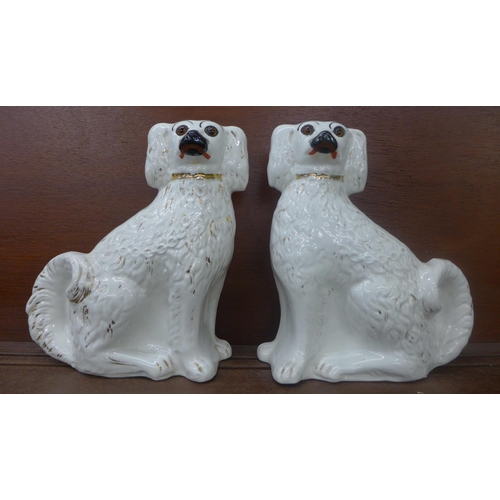 610 - A pair of Staffordshire spaniels, a/f, 31cm