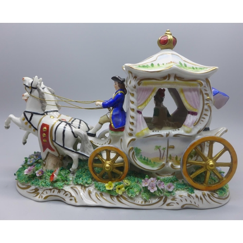 613 - A Sitzendorf figure of a lady in a horse drawn carriage, 17cm