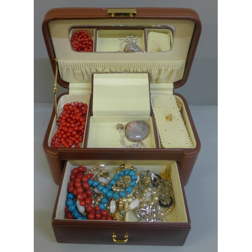 626 - A case of costume jewellery including a silver pendant and chain and brooch