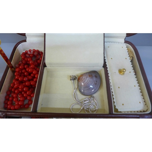 626 - A case of costume jewellery including a silver pendant and chain and brooch