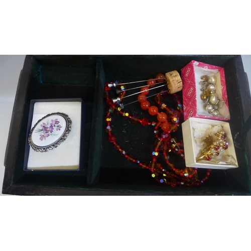 673 - A jewellery box with decorative lid and costume jewellery