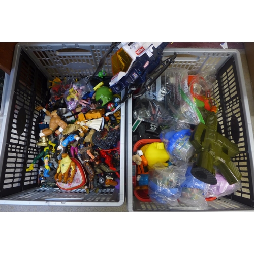 708 - Two boxes of plastic models, superheroes, Smurfs, toys, Action Man weapons, etc.