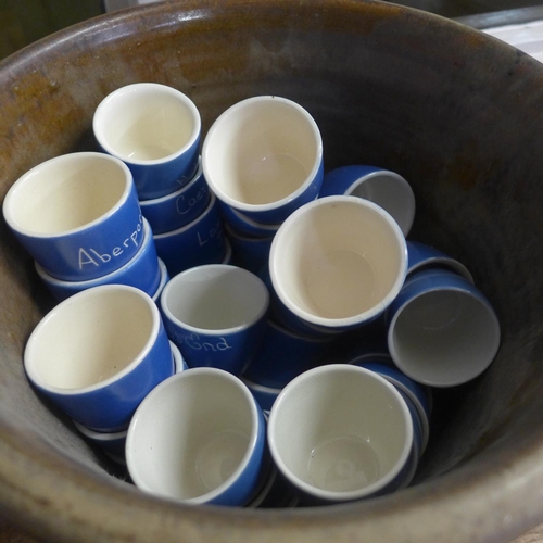 765 - A Danesby Wart vase, stoneware jardiniere and a box of Devon Pottery egg cups