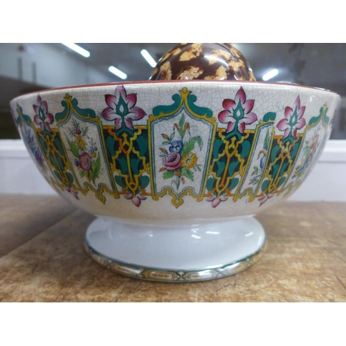 766 - A 19th Century large ceramic bowl with a collection of carved agate and other ceramic balls