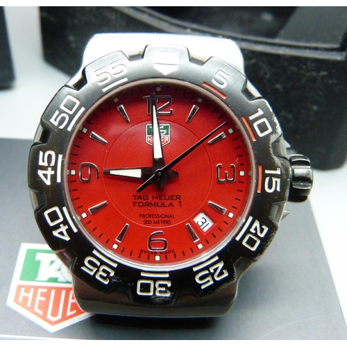 815 - A Tag Heuer Formula 1 wristwatch with original guarantee and instruction booklet, boxed