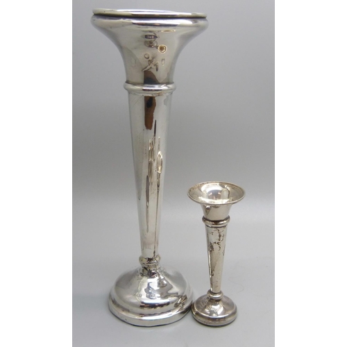 819 - Two silver vases, a pair of silver napkin rings and three other napkin rings