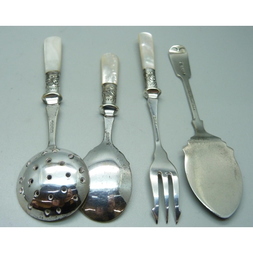 825 - A silver serving spoon, Sheffield 1906, 79g, and other servers