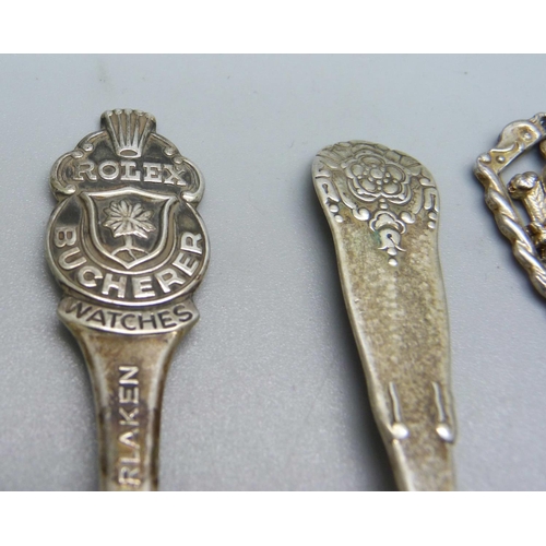 833 - A hallmarked silver spoon, an 830 silver spoon, a Rolex spoon and two other spoons