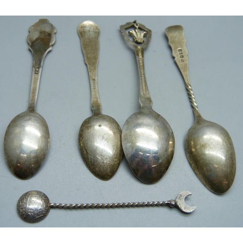 833 - A hallmarked silver spoon, an 830 silver spoon, a Rolex spoon and two other spoons