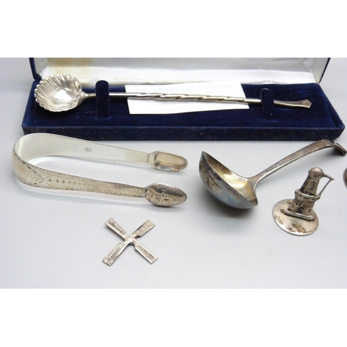 848 - A pair of silver sugar bows, silver spoon, silver base vase, silver ladle and a white metal model of... 