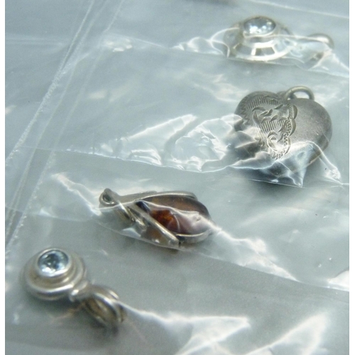 861 - Fourteen silver pendants