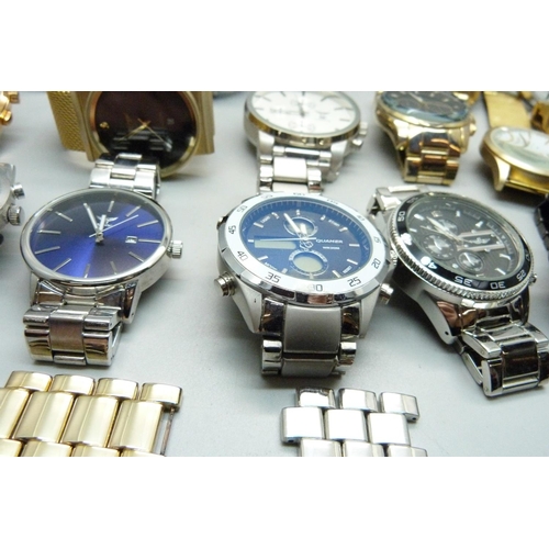 879 - A collection of fashion wristwatches