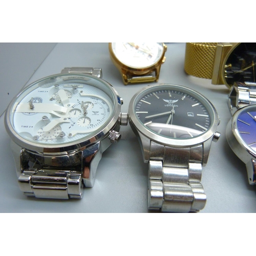 879 - A collection of fashion wristwatches