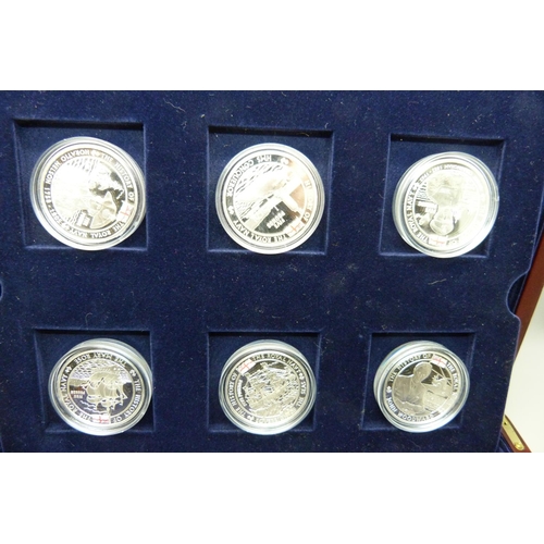 886 - A cased set of eighteen The History of the Royal Navy silver proof Five Pounds coins, Channel Island... 