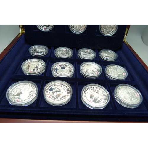 886 - A cased set of eighteen The History of the Royal Navy silver proof Five Pounds coins, Channel Island... 