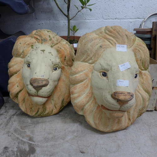 2499 - Pair of lion head garden wall decorations