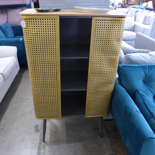 1387 - A gold rattan effect industrial style cabinet