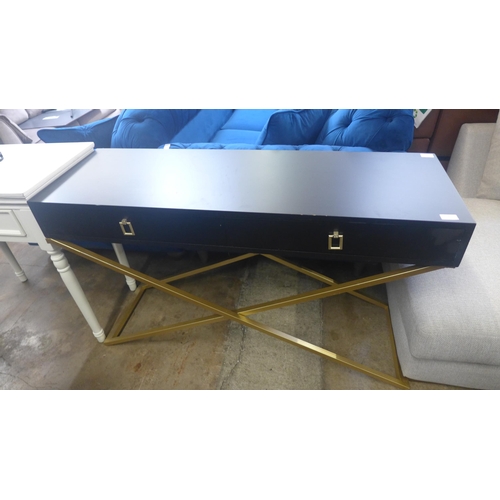 1416 - A black two drawer console table with gold legs, slight damage