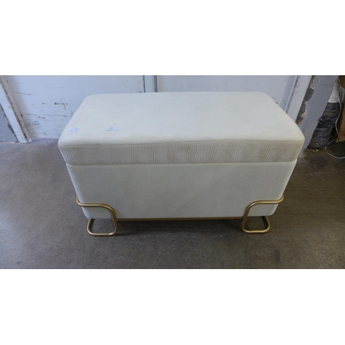 1512 - An ivory upholstered ottoman/footstool