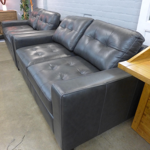 1320 - A pair of Montana slate leather pinched back 2 seater sofas