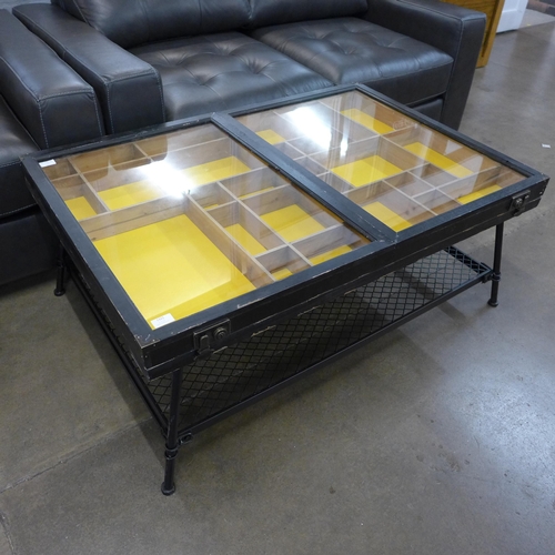 1321 - An industrial style wood, metal and glass collector's coffee table