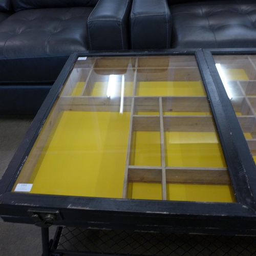 1321 - An industrial style wood, metal and glass collector's coffee table