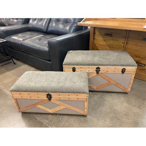 1323A - A pair of upholstered storage trunks