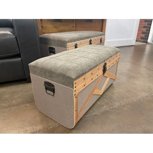 1323A - A pair of upholstered storage trunks