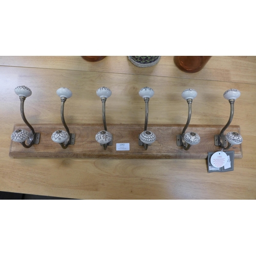 1342 - A rack of six coat hooks with ceramic knobs (HH574624)   #