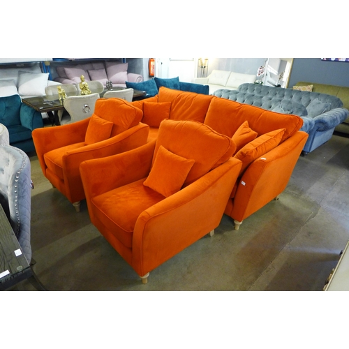 1373 - A tangerine velvet four seater sofa with a pair of armchairs - small tear on sofa