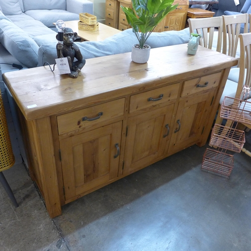 1392 - An oak three drawer three door sideboard