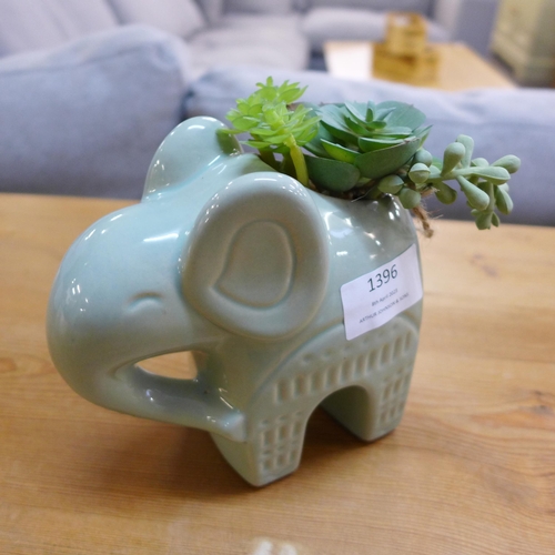 1396 - A faux succulent plant in a green ceramic elephant - H 17cms  (67689704 )