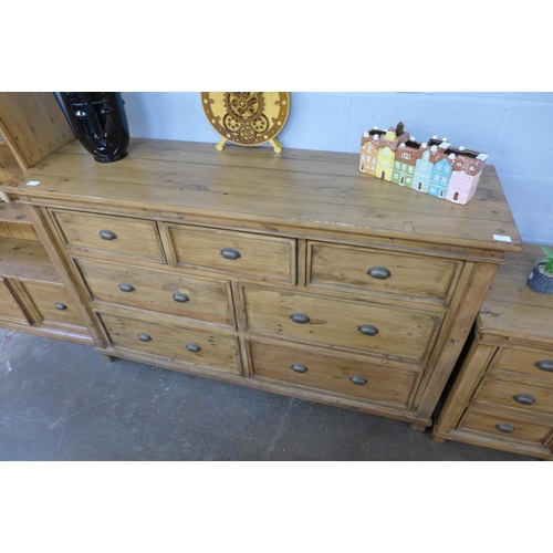 1398 - A large pine three over two sideboard/chest of drawers - slight wear