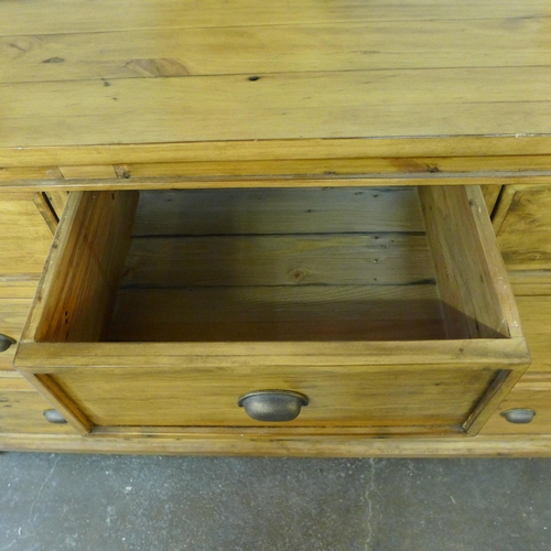 1398 - A large pine three over two sideboard/chest of drawers - slight wear