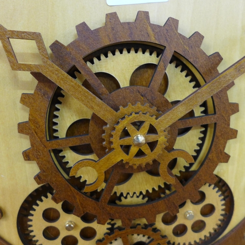 1401 - A wooden moving gears clock in the form of an alarm clock