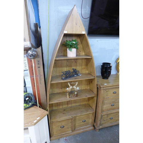 1403 - A large pine bookcase in the form of a boat