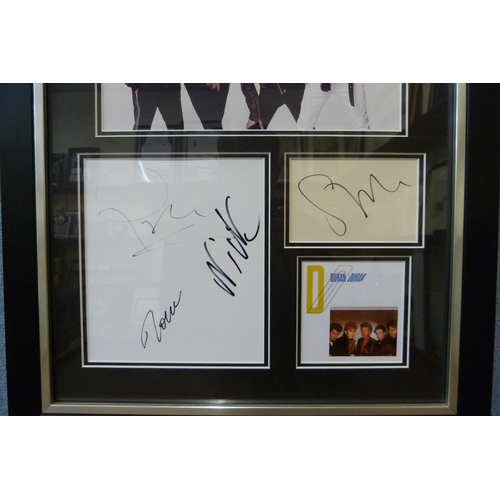 603 - A framed autograph display, Duran Duran, with Universal Autograph Club certificate of authenticity