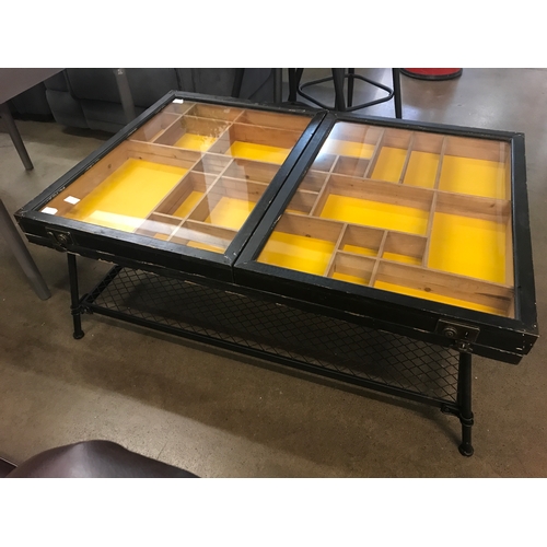 1334 - An industrial style wood, metal and glass collector's coffee table