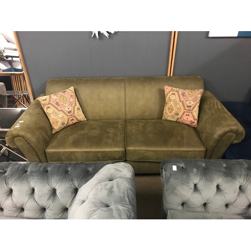 1364 - A moss green upholstered four seater sofa