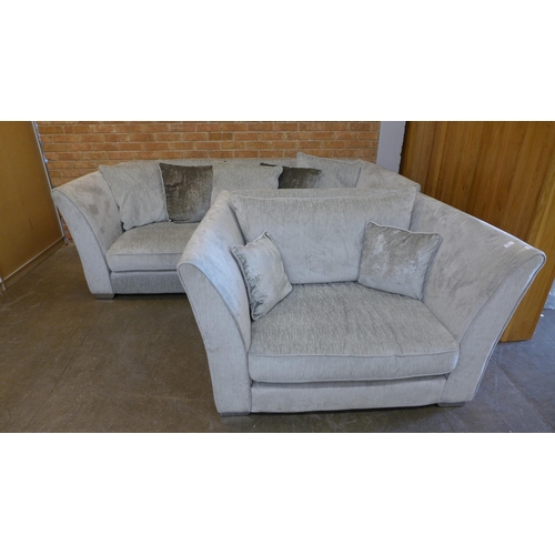 1414 - An Aria silver upholstered four seater sofa  (W- 240cm D- 112cm H- 82cm) and love seat  (W- 145cm D-... 