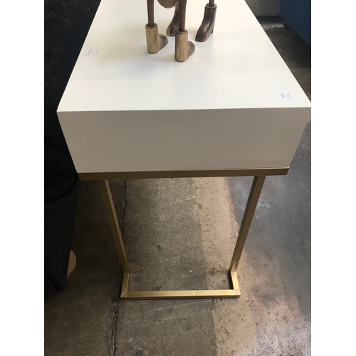 1418 - A white two drawer console table with gold legs