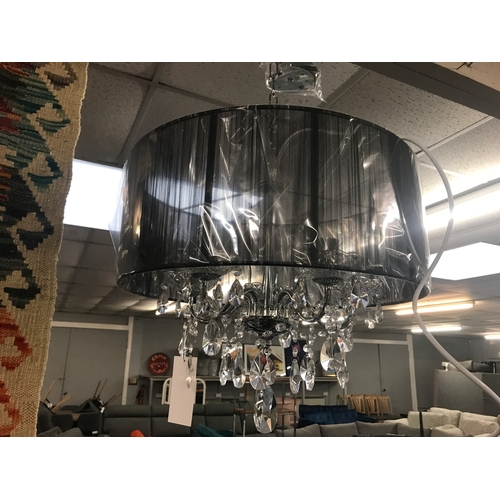 1438 - A five arm chandelier with black shade