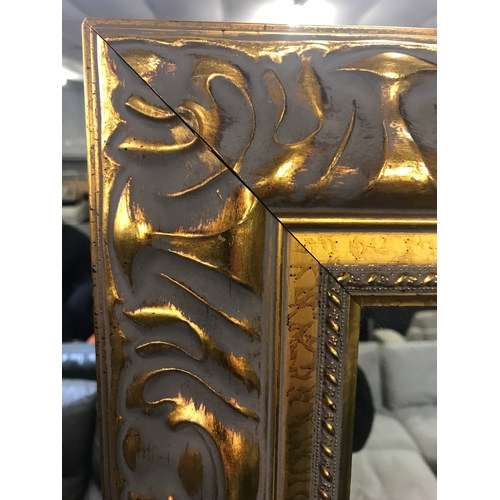 1440 - A large gilt framed mirror