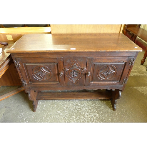 132 - A 17th Century style carved oak credence cupboard