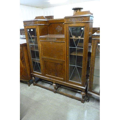 134 - A carved oak side by side bureau bookcase