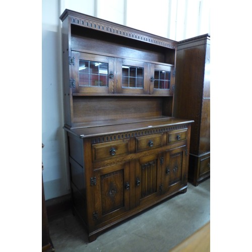 236 - A carved oak linenfold dresser