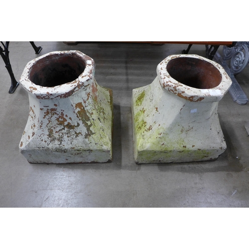 246 - A pair of terracotta chimney pot bases and a set of painted step ladders