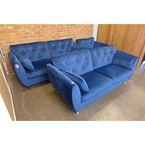 1500 - A pair of blue Hoxton velvet three seater sofas (W- 188cm D- 80cm H- 90cm) and arm chair (W- 192cm D... 