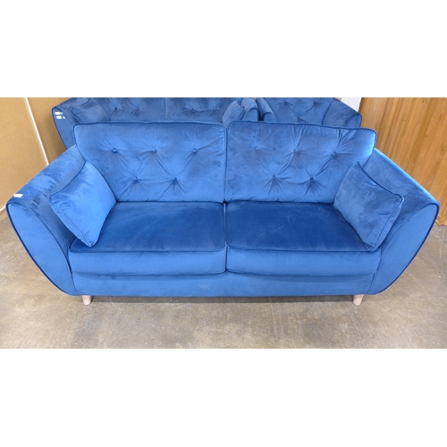 1500 - A pair of blue Hoxton velvet three seater sofas (W- 188cm D- 80cm H- 90cm) and arm chair (W- 192cm D... 