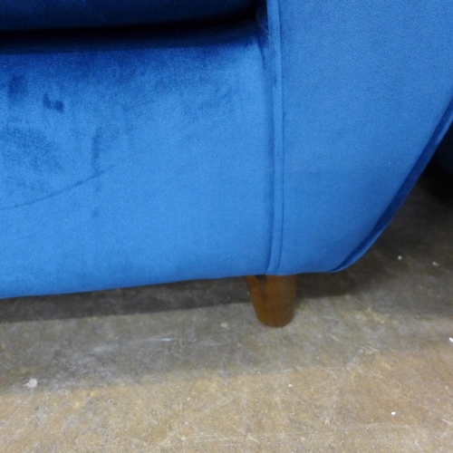 1500 - A pair of blue Hoxton velvet three seater sofas (W- 188cm D- 80cm H- 90cm) and arm chair (W- 192cm D... 